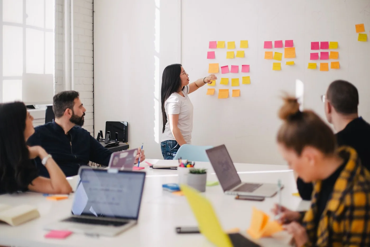 Marketing team aligning on strategy around a table